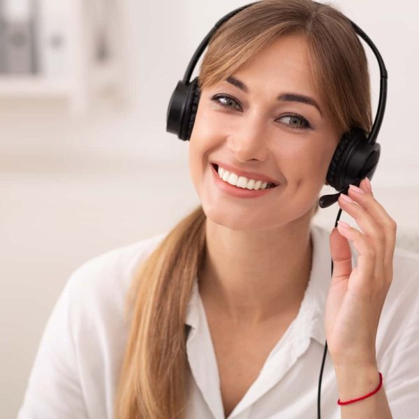 smiling-woman-in-headset-working-in-call-center-of-2022-12-16-08-38-43-utc-min.jpg